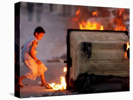 Bahraini Child Plays Near to Burning Tires and a Dumpster-null-Premier Image Canvas