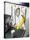 Banana and Kitchen Tools Hanging on Hooks in Kitchen-Kröger & Gross-Premier Image Canvas