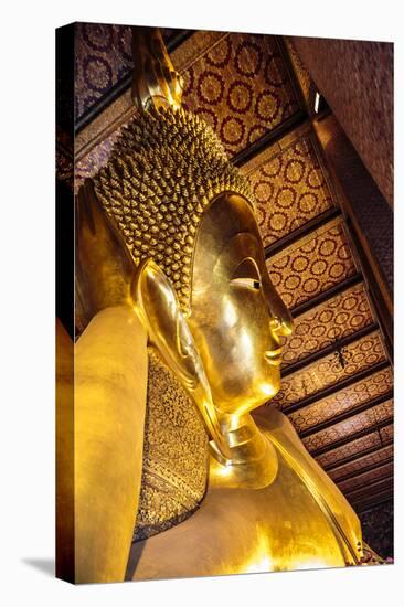 Bangkok, Thailand. Giant reclining gold Buddha statue at Wat Pho temple-Miva Stock-Premier Image Canvas