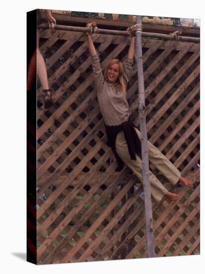 Barefoot Girl Swinging on Structure Containing Baby Chicks in Coop, Woodstock Music and Art Fair-John Dominis-Premier Image Canvas