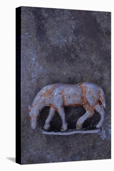 Battered Lead Model of Grazing Horse Lying on Tarnished Metal-Den Reader-Premier Image Canvas