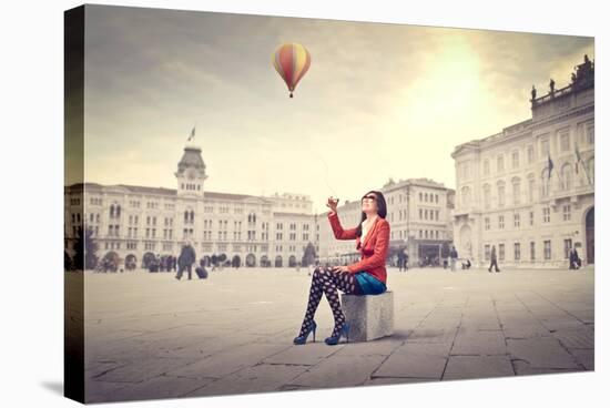 Beautiful Woman In Colored Clothes On A Square With Hot-Air Balloon In The Background-olly2-Stretched Canvas