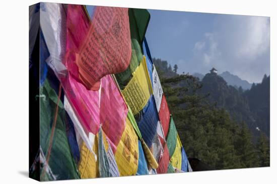 Bhutan, Paro. Colorful prayer flags in front of small outbuilding of the Tiger's Nest.-Cindy Miller Hopkins-Premier Image Canvas