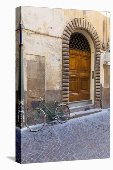 Bicycle parked outside front door, Lucca, Tuscany, Italy, Europe-John Guidi-Premier Image Canvas