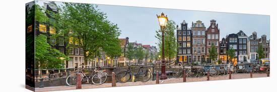 Bikes and Houses Along Canal at Dusk at Intersection of Herengracht and Brouwersgracht-null-Stretched Canvas