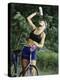 Blond Bicyclist Cooling Off with Bottled Water-null-Premier Image Canvas