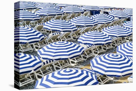 Blue and white beach parasols, Nice, Alpes Maritimes, Cote d'Azur, Provence, France, Mediterranean,-Fraser Hall-Premier Image Canvas