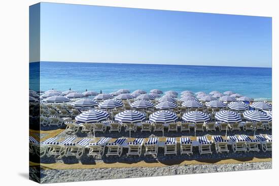 Blue and white beach parasols, Nice, Alpes-Maritimes, Cote d'Azur, Provence, French Riviera, France-Fraser Hall-Premier Image Canvas