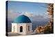 Blue domed Greek Orthodox church with bougainvillea flowers in Oia, Santorini, Greece.-Michele Niles-Premier Image Canvas