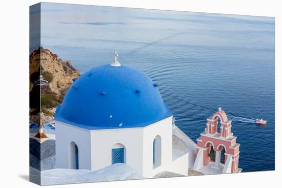 Blue domed white church overlooking boat in Aegean Sea, Santorini, Cyclades-Ed Hasler-Premier Image Canvas