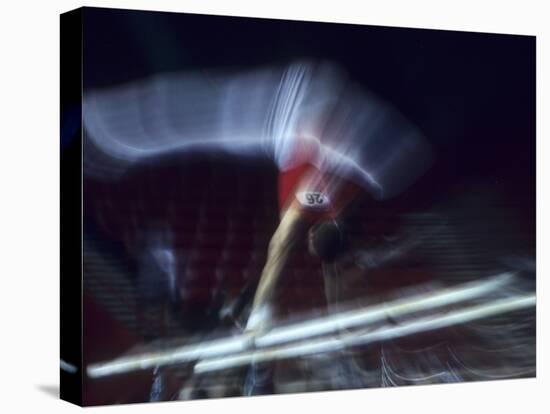 Blurred Action of Male Gymnast on the Parallel Bars-null-Premier Image Canvas