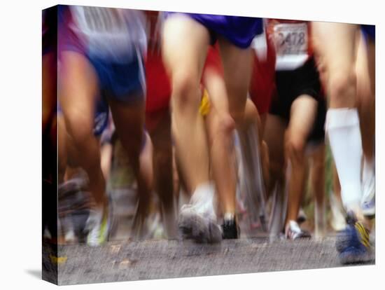 Blurred Action of Runner's Legs Competing in a Race-null-Premier Image Canvas