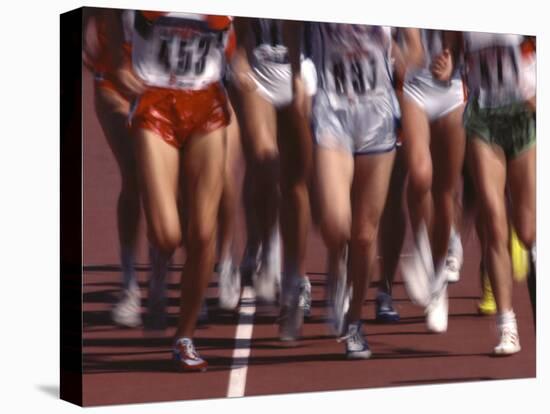 Blurred Action of Women Runners During a Track Race-Steven Sutton-Premier Image Canvas