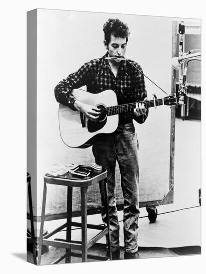 Bob Dylan Playing Guitar and Harmonica into Microphone. 1965-null-Stretched Canvas