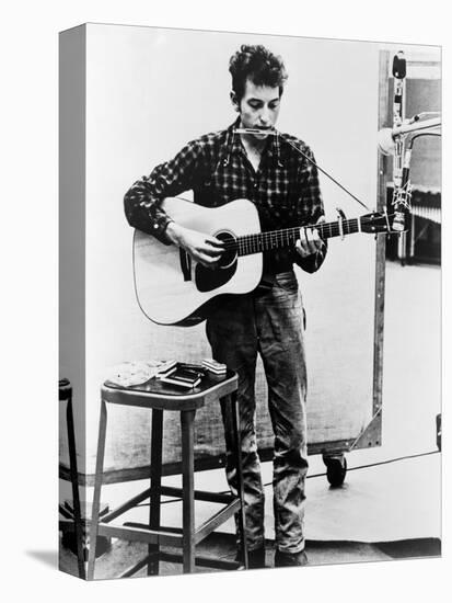 Bob Dylan Playing Guitar and Harmonica into Microphone. 1965-null-Stretched Canvas