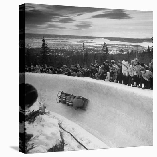 Bobsled Racing by on a Big Vendleboe Curve During the Winter Olympics-Nat Farbman-Premier Image Canvas