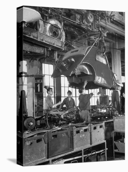 Body Being Lowered on to "Topolino" Chassis by Workers on Assembly Line at Fiat Production Plant-Alfred Eisenstaedt-Premier Image Canvas