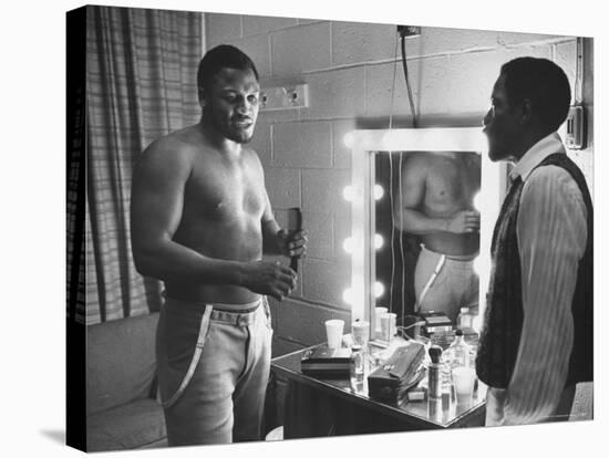 Boxer Joe Frazier Dressing During Training for a Fight Against Muhammad Ali-John Shearer-Premier Image Canvas