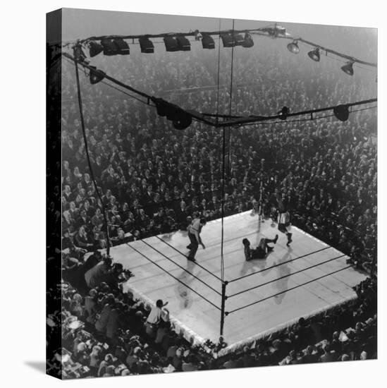 Boxing Ring as Heavyweight Champion Joe Louis Lies on Canvas, after Floored by Jersey Joe Walcott-Gjon Mili-Premier Image Canvas