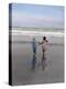 Boy and Girl on at Edge of Ocean Running and Holding Hands.-Nora Hernandez-Premier Image Canvas