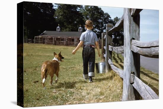 Boy and His Dog Walking Along a Fence-William P. Gottlieb-Premier Image Canvas