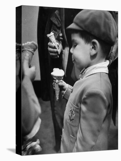 Boy Eating Ice Cream Cone at the Circus in Madison Square Garden-Cornell Capa-Premier Image Canvas