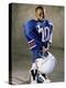 Boy in an Oversized Football Uniform Holding a Helmet-null-Premier Image Canvas