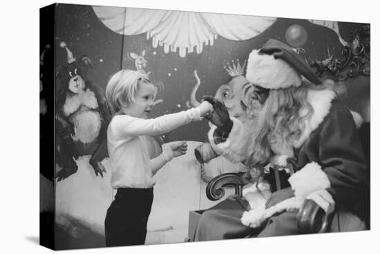 Boy Kissing African American Santa Claus in Unidentified Department Store. 1970-Ralph Morse-Premier Image Canvas