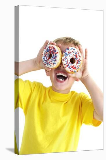 Boy Playing with Doughnuts-Ian Boddy-Premier Image Canvas