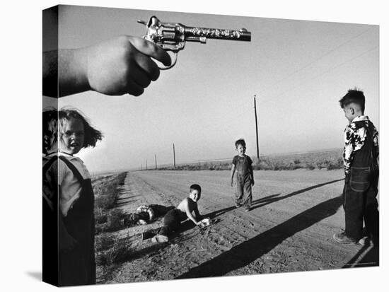 Boy's Hand Holding a Toy Six Shooter Pistol During a Game of "Cops and Robbers"-Howard Sochurek-Premier Image Canvas