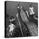 Boys and Girls Play on the Slides at a Playground-null-Premier Image Canvas