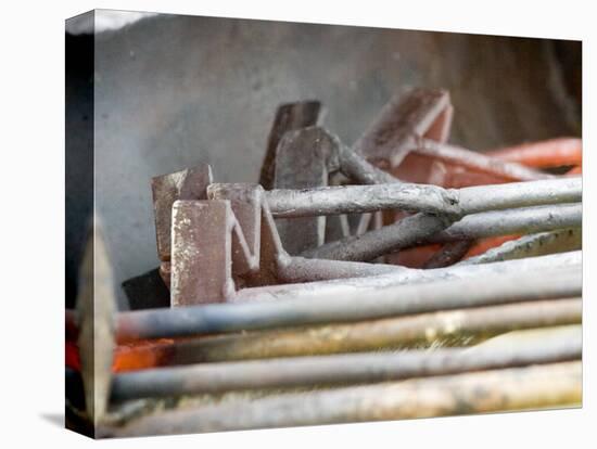 Branding Irons at Hughes Ranch near Stanford, Montana, USA-Chuck Haney-Premier Image Canvas