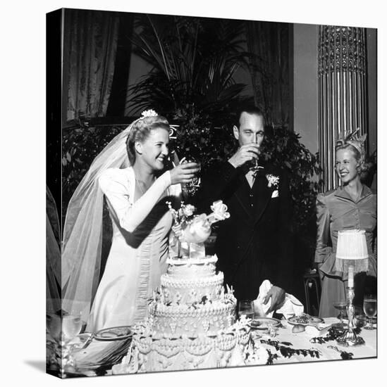 Bride and Groom Drinking Champagne After Wedding Ceremony in Manhattan-John Phillips-Premier Image Canvas