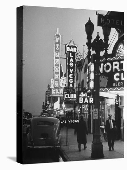 Brightly Lit Casinos Lining the Street-Peter Stackpole-Premier Image Canvas