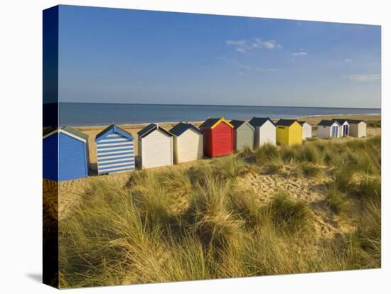 Brightly Painted Beach Huts, Rear View, in Afternoon Sunshine Below Gun Hill, Suffolk, England-Neale Clark-Premier Image Canvas