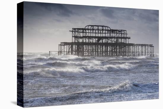 Brighton's ruined west pier is surrounded by rough sea-Charles Bowman-Premier Image Canvas