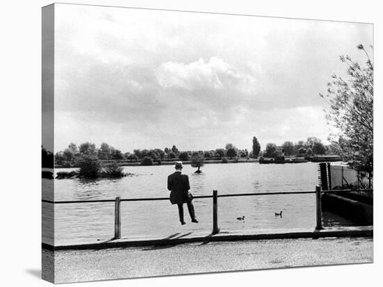 British Actor Alec Guinness Sitting Alone by Lake in a Park-Cornell Capa-Premier Image Canvas