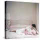 British actress Joan Collins in a pink bedroom with a pink toy poodle (photo)-null-Stretched Canvas