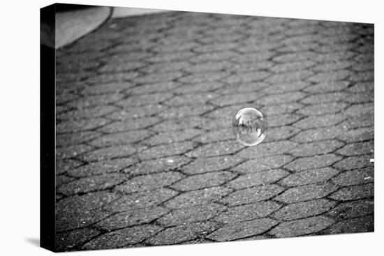 Bubble Floating Above Sidewalk-null-Stretched Canvas