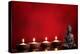 Buddha and Candles on Red Background, Religious Concept.-Sofiaworld-Premier Image Canvas