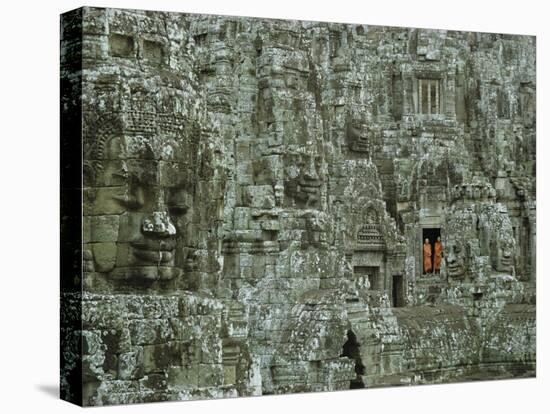 Buddhist Monks in a Doorway of the Ruins of the Bayon at Angkor-W^ E^ Garrett-Stretched Canvas