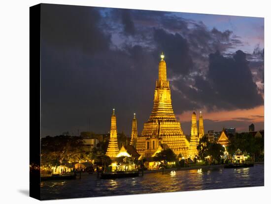 Buddhist Temple Lit Up at Dawn, Wat Arun, Chao Phraya River, Bangkok, Thailand-null-Premier Image Canvas