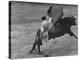 Bull Fighter Manolete Raising His Cape as Bull Charges Past Him in Bull Ring During Bull Fight-William C^ Shrout-Premier Image Canvas