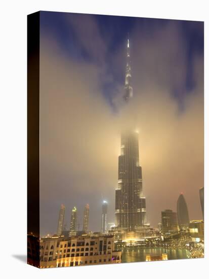 Burj Khalifa Illuminates the Clouds and Surrounding Skyline at Night, Downtown, Dubai, Uae-Amanda Hall-Premier Image Canvas