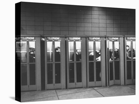 Busy Telephone Booths During an Airline Strike-Robert W^ Kelley-Premier Image Canvas