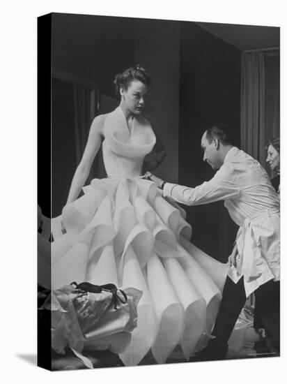 Buyer Sampling an Evening Dress on a Model to Check Its Quality-Nat Farbman-Premier Image Canvas