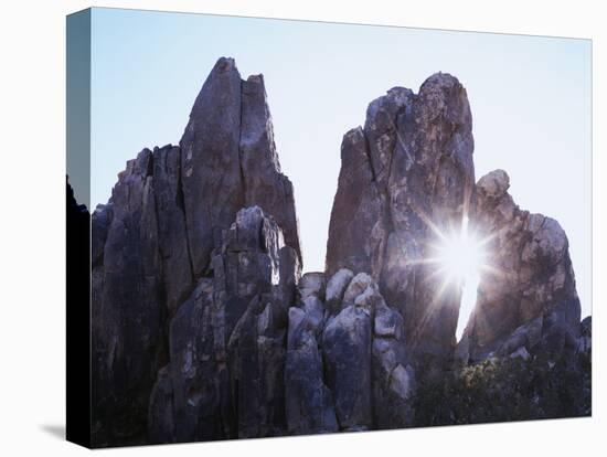 California, Joshua Tree National Park, the Suns Rays Shine Through a Rock Window-Christopher Talbot Frank-Premier Image Canvas