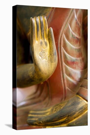Cambodia, Siem Reap, golden hands on red wood statue of Buddha.-Merrill Images-Premier Image Canvas