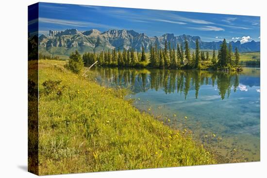 Canada, Alberta, Jasper National Park. Mountains and trees reflection in Talbot Lake.-Jaynes Gallery-Premier Image Canvas