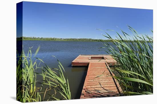 Canada, Manitoba, Saint Leon. Wooden dock on Lake St. Leon.-Jaynes Gallery-Premier Image Canvas